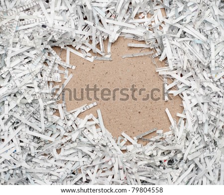 Shredded white paper with recycled brown paper copy space