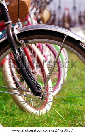 Bicycle wheels in a row. Bicycle details