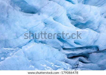 Various ice patterns and hues of blue in glacial ice in a remote area of Alaska