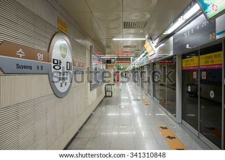 Busan, Korea - September 19, 2015: Mangmi Station platform of Busan Subway Line 3.  Busan Metro Line 3 is operated between Suyeong and Daejeo and its color is rachel.