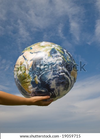 Hand of a woman holding earth