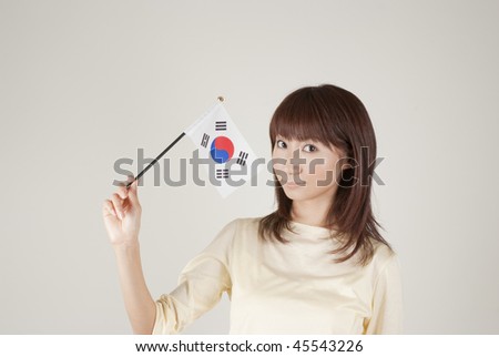 Young woman holding Korean flag