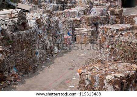 Waste paper recycling. This paper mill is a factory devoted to making paper and cardboard from recycled paper  using a Fourdrinier Machine.