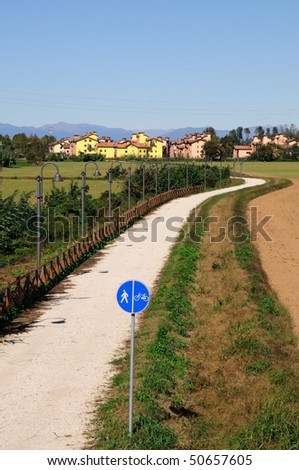 A bike path leads to a small town