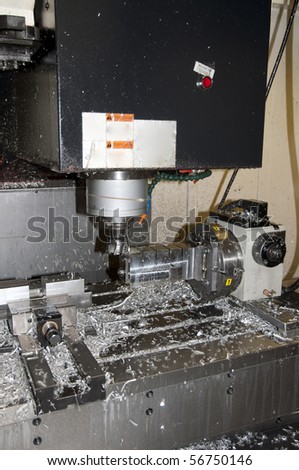 CNC drilling and milling in a workshop that manufactures disks and blades for cutting paper.