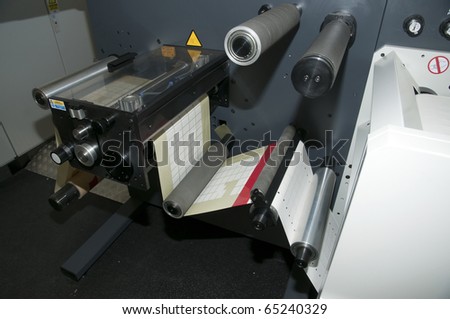 Print finishing equipment for labels