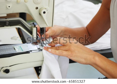 Seamstress at work in a factory of knitted underwear