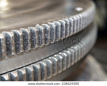 Closeup of many metal gears, blurred