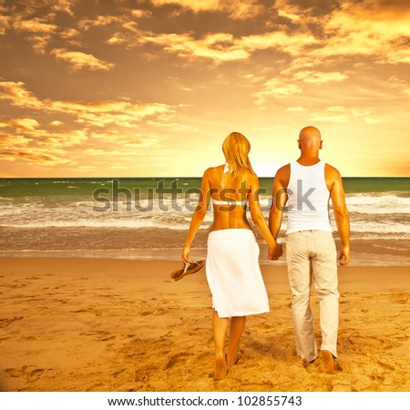 Happy couple on the beach, romantic travel, honeymoon vacation, summer holidays, people walking on sea sunset and holding hands, loving family relaxing outdoor, love concept