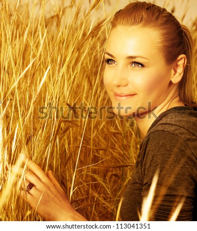 Picture of sweet lovely female enjoying freedom on golden wheat field, closeup portrait of beautiful young blond female on yellow hay ryes background, agriculture nature, grain harvest season