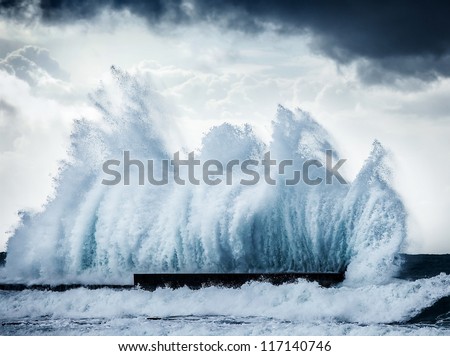 Giant wave splash, beautiful dark dramatic seascape