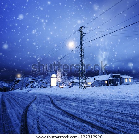 Photo of blizzard in the village, snow falling on the house, night wintertime landscape, Christmastime greeting card, winter holiday, luxury ski resort, cozy homes in Lebanon, Xmas vacation concept