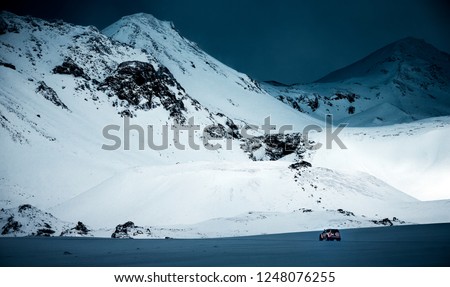 Expedition to the North Pole, big powerful jeep in the snowy, majestic great mountaing, amazing winter landscape, active extreme life, Iceland