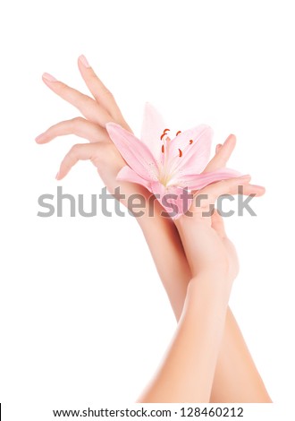 Image of beautiful female hands with pink lily flowers isolated on white background, arms skin care, woman\'s body part with pure flower, natural cosmetics, luxury manicure, spa day, beauty concept