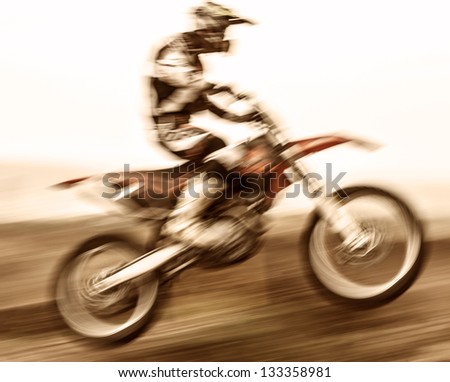 Extreme sport, slow motion on motorbike, pro race driver jumping on the dirt bike, motocross, speed and challenge concept