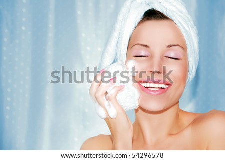 beautiful woman cleaning face. Beauty treatment