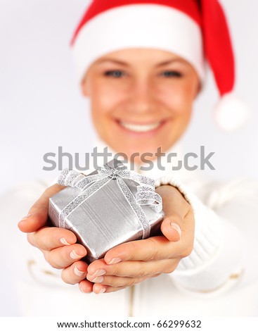 Happy Santa Claus girl with holiday present box as Christmas & new year gift or ornament decoration, isolated on white background