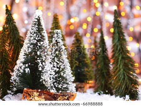 Christmas tree forest, holiday background with winter ornament & abstract defocus lights decoration