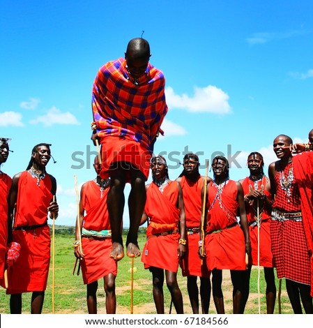 AFRICA,KENYA,MASAI MARA - NOVEMBER 12:Masai warriors dancing traditional jumps as cultural ceremony,review of daily life of local people,near to Masai Mara National Park Reserve,November 12,2008,Kenya
