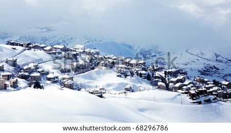 Winter mountain village landscape with snow and cute little houses, beautiful nature panoramic image