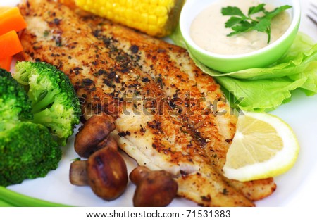 Tasty healthy fish fillet with steamed vegetables
