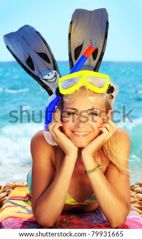 Beautiful female closeup portrait on the beach wearing snorkeling equipment, water sport, healthy lifestyle concept