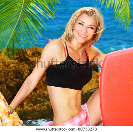 Beautiful sporty female holding body board, outdoor beach portrait, water sport, healthy lifestyle concept