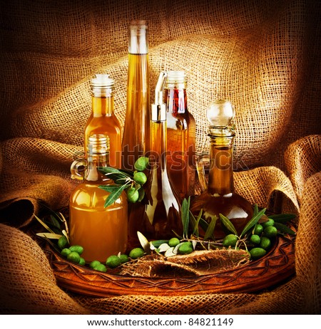 Different salad dressings, olive oils, vinegars, seasoning, condiment, sauces, sauces, dips..etc. dark still life with canvas