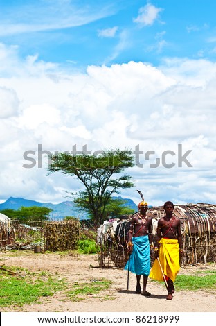 SAMBURU, KENYA - NOVEMBER 8: unidentified African tribal men, walking in the village on November 8, 2008 in tribal village near Samburu National Park Reserve, Kenya