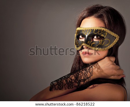 Beautiful female wearing mask, mysterious girl at masquerade,stylish Beautiful female wearing mask, mysterious girl at masquerade,stylish