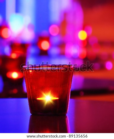 Romantic interior of a luxury restaurant with warm cozy candlelight, Christmas celebration
