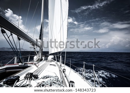 Luxury sail boat in the sea at evening, extreme water sport, yacht in action, summer transport, trip in the ocean, active holidays concept