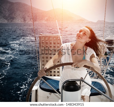 Woman behind the wheel yacht, enjoying sea nature and mountains landscape, active sailor girl, female driving luxury water transport, summertime concept