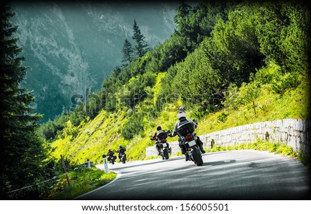 Group Of Moto Bikers On Mountainous Highway, Riding On Curve Road Pass Across Alpine Mountains, Extreme Lifestyle, Freedom Concept