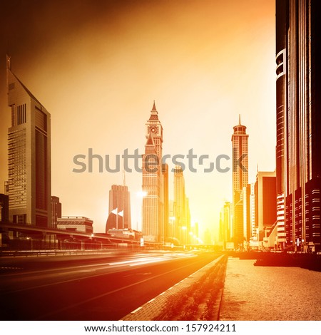 Dubai City In Sunset, Bright Yellow Sun Light, Beautiful Panorama Of Modern Architecture, Financial Center, Luxury District, Business City Concept