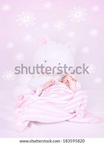 Sweet baby sleep in own pink bedroom with great white teddy bear, cute interior for child with flower print on the wall, happy childhood concept