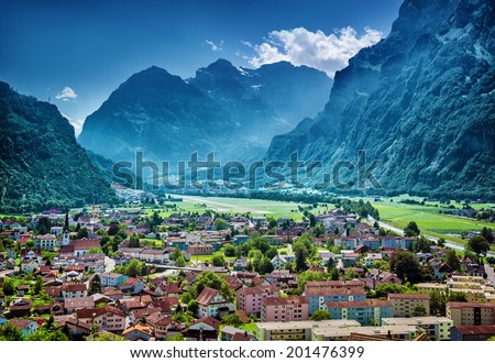 Beautiful mountainous village, many little buildings in European mountain city, luxury resort, active travel and vacation concept