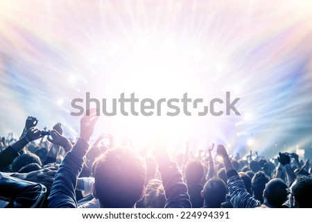 Outdoor concert, happy people with raised up hand enjoying night in the club, night entertainment, active lifestyle, New Year celebration, partying concept