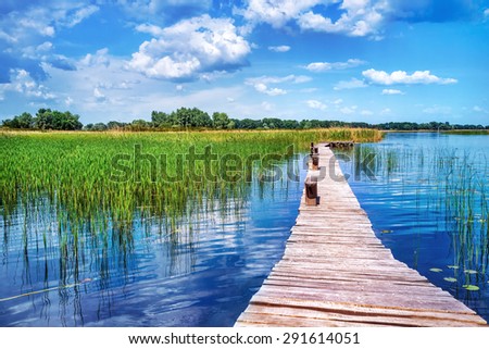 Beautiful nature landscape, beauty of countryside places, old wooden bridge across pond, perfect place for summer vacation