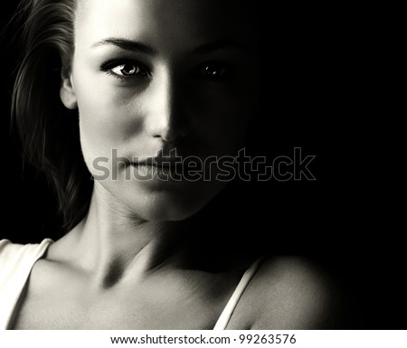 Black and white glamor woman portrait, dark beautiful face, female isolated on black background, stylish sexy look, young lady studio shot