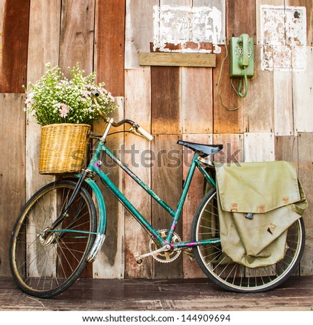 Vintage Bicycle On Vintage Wooden House Wall
