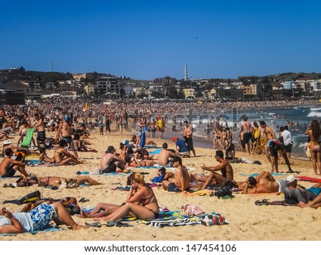 SYDNEY-JANUARY 1 :People relaxing on the beach to celebrate new year on 1 January 2013 at Bondi beach in Sydney,Australia.Bondi beach is one of the most famous beach in the world .