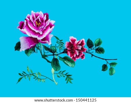 Silk Flower Sewing By Hand On Blue Background.