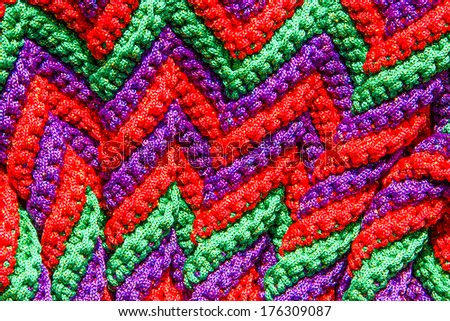 Colorful crocheting pattern close up background.