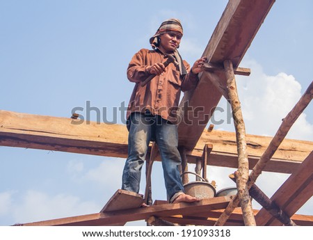 Builder working on high area.
