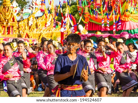 MAHASARAKHAM,THAILAND - MAY 18 : Thai group performing Thai music and Thai dancing in Rocket festival  parade  on May 18,2014 .This festival for agriculture  to celebration the raining season.