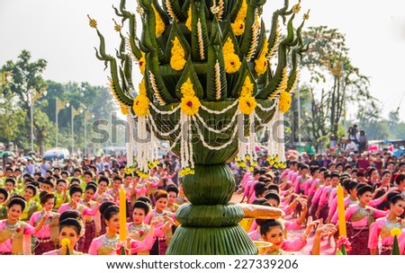 NAKHON PHANOM ,THAILAND-OCTOBER 8: Buddhism offering Thai dancing and flower decorated to worship Pratat Pranom pagoda on 8 October 2014 .Pratat Pranom pagoda is important for buddhism.