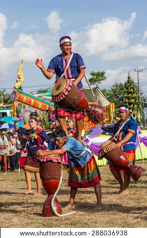 MAHASARAKHAM,THAILAND - MAY 31 : Thai group performing Thai music and Thai dancing  in Rocket festival  on May 31,2015 .This festival for agriculture  to celebration the raining season.