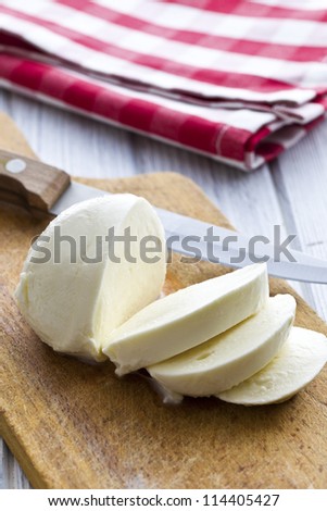 sliced mozzarella cheese on kitchen table