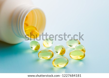 Omega 3 gel capsules. Fish oil pills. Healthy omega-3 in bottle.
